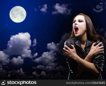 Zombie girl on night sky with moon