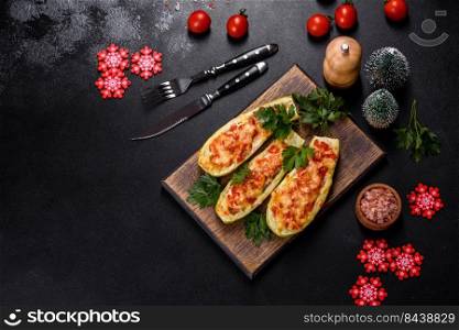 Zucchini stuffed with meat, vegetables and cheese. Zucchini boats. Loaded zucchini. Baked stuffed zucchini boats with minced chicken mushrooms and vegetables with cheese. Christmas table