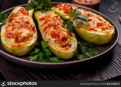 Zucchini stuffed with meat, vegetables and cheese. Zucchini boats. Loaded zucchini. Baked stuffed zucchini boats with minced chicken mushrooms and vegetables with cheese