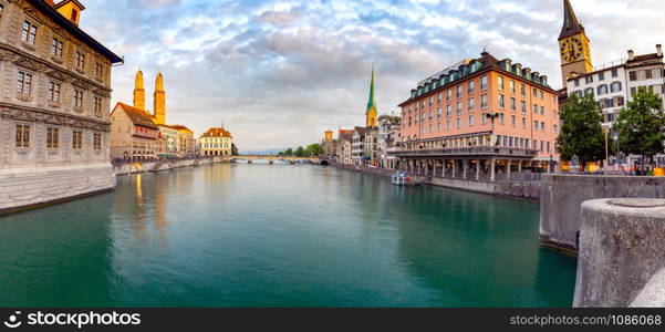 Zurich. Panoramic view of the city promenade and the facades of medieval houses at dawn. Switzerland.. Zurich. Scenic panoramic view of the city promenade and at dawn.