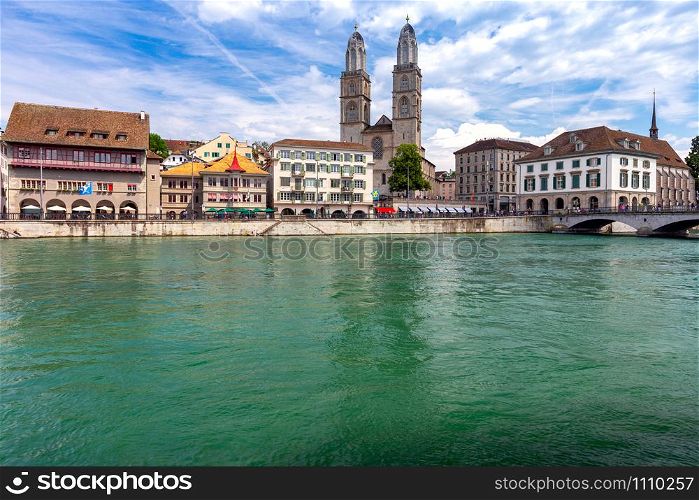 Zurich. View of the city promenade and the facades of medieval houses on a sunny day. Switzerland.. Zurich. Scenic view of the city promenade on a sunny day.