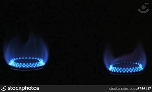 Zwei Gasflammen drehen sich um die eigene Achse.